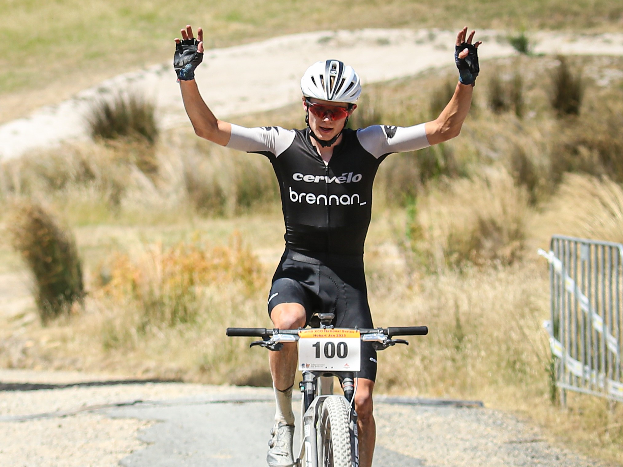 Australian and Melbourne mountain bike rider Jack Ward crosses the finish line, winning the AusCycling XC National Series round in Glenorchy, Hobart, Tasmania. Photo by Cycling Photos Tasmania.